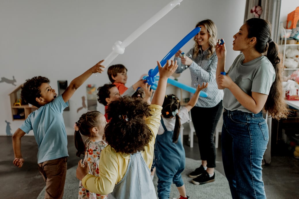 Kids Standing and Raising Their Hands